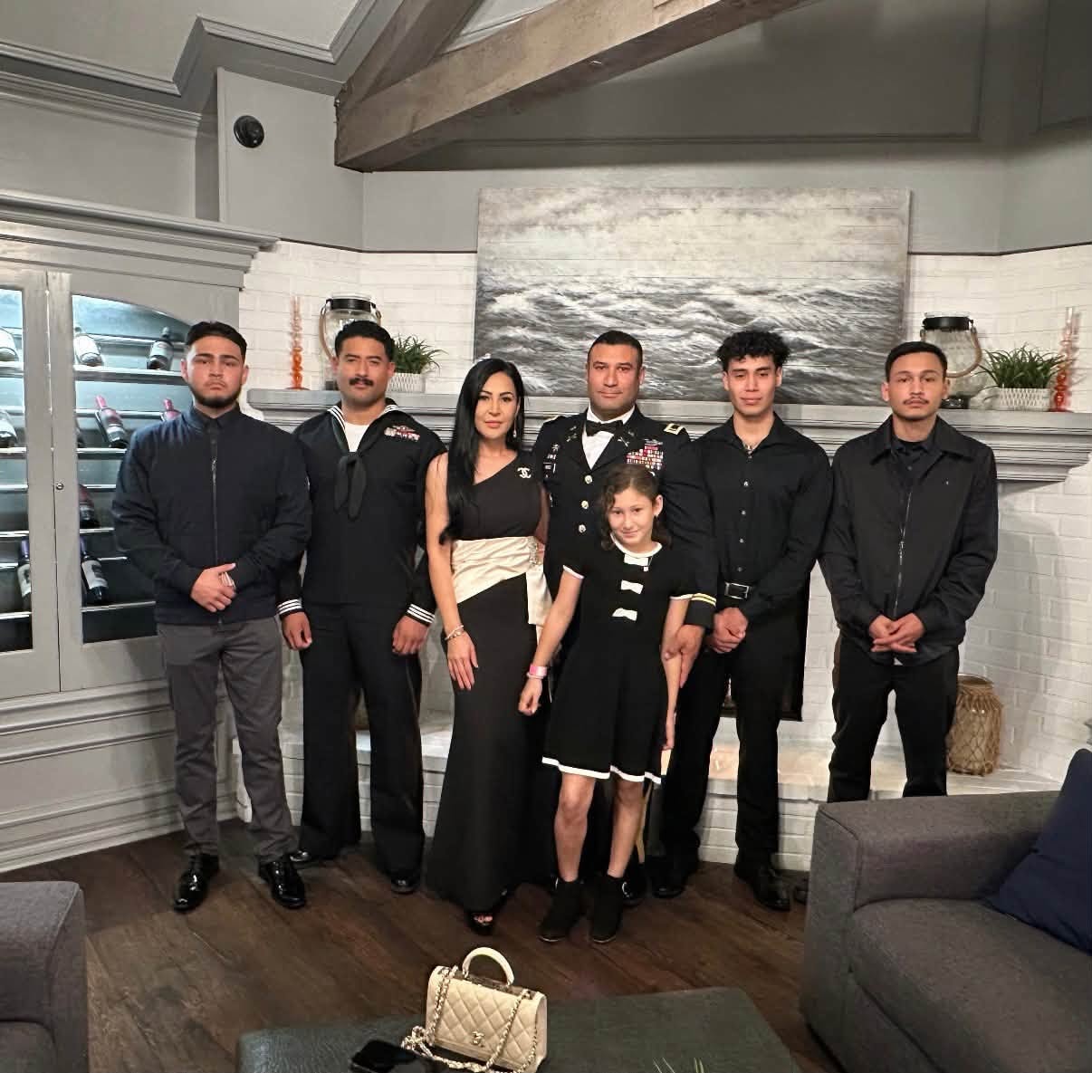 The Jimenez family in formal attire with sons in military uniform
